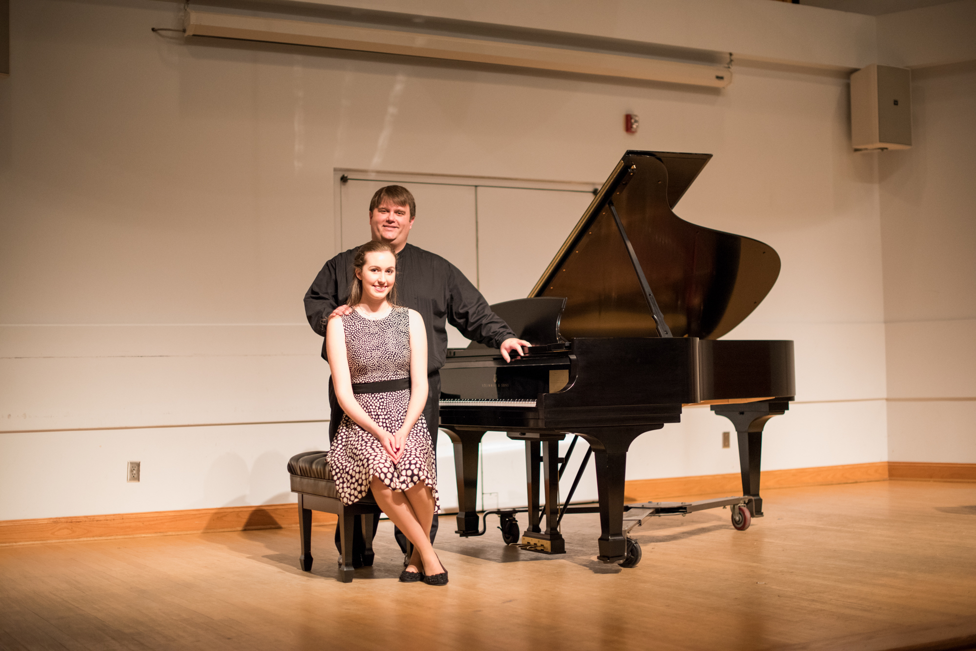 two musicians onstage with Steinway piano